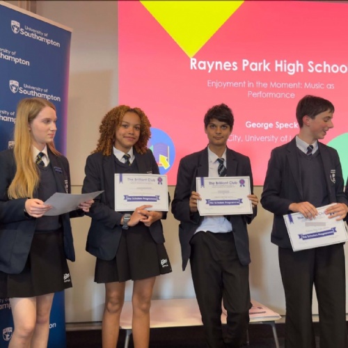 A group of students are holding certificates